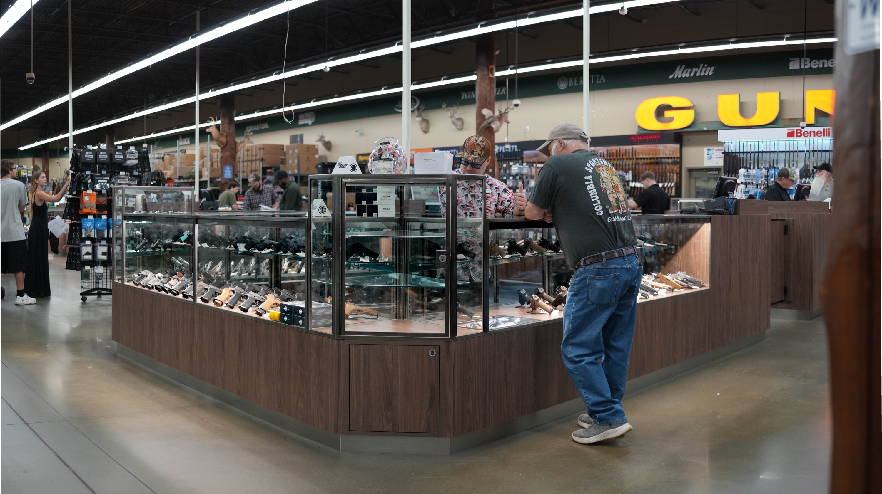 Panoramic view of the finished custom display cases at Green Top Sporting Goods